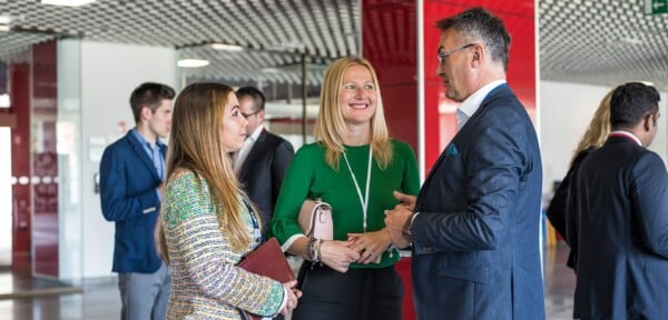 Customers talking to each other at a business event